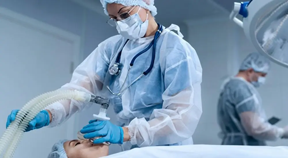 Anesthesiology and pain management: anesthesiologist administering anesthesia to a patient before surgery.
